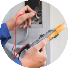 Technician using a multimeter to diagnose HVAC system, emphasizing professional repair services for heating and cooling solutions.