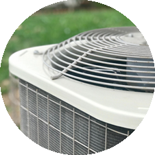 Air conditioning unit close-up, showcasing cooling system components, relevant to PROTECH HVAC's installation and maintenance services for home comfort.